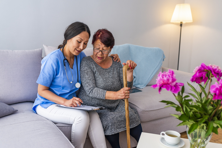 Professional caregiver helping senior with daily activities in Thornton Colorado