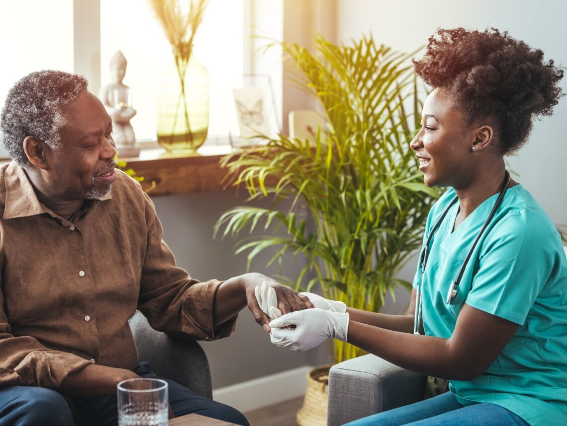 Professional home health caregiver providing care to senior in Denver Colorado